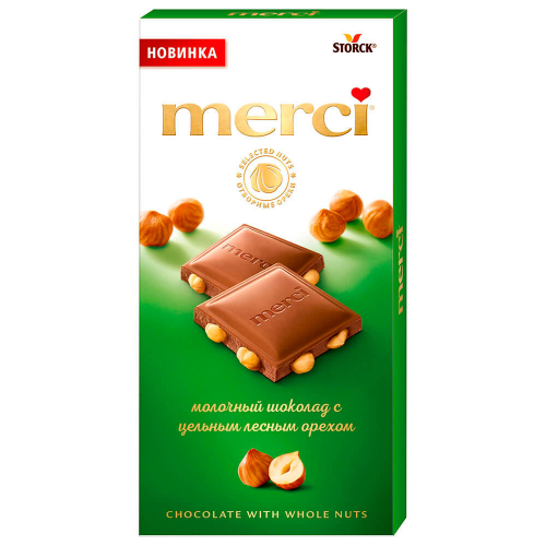 Шоколад Merci 100г молочный с целым лесным орехом шторк
