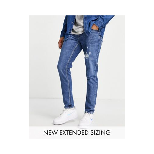 Темно-синие узкие джинсы с потертостями ASOS DESIGN Голубой